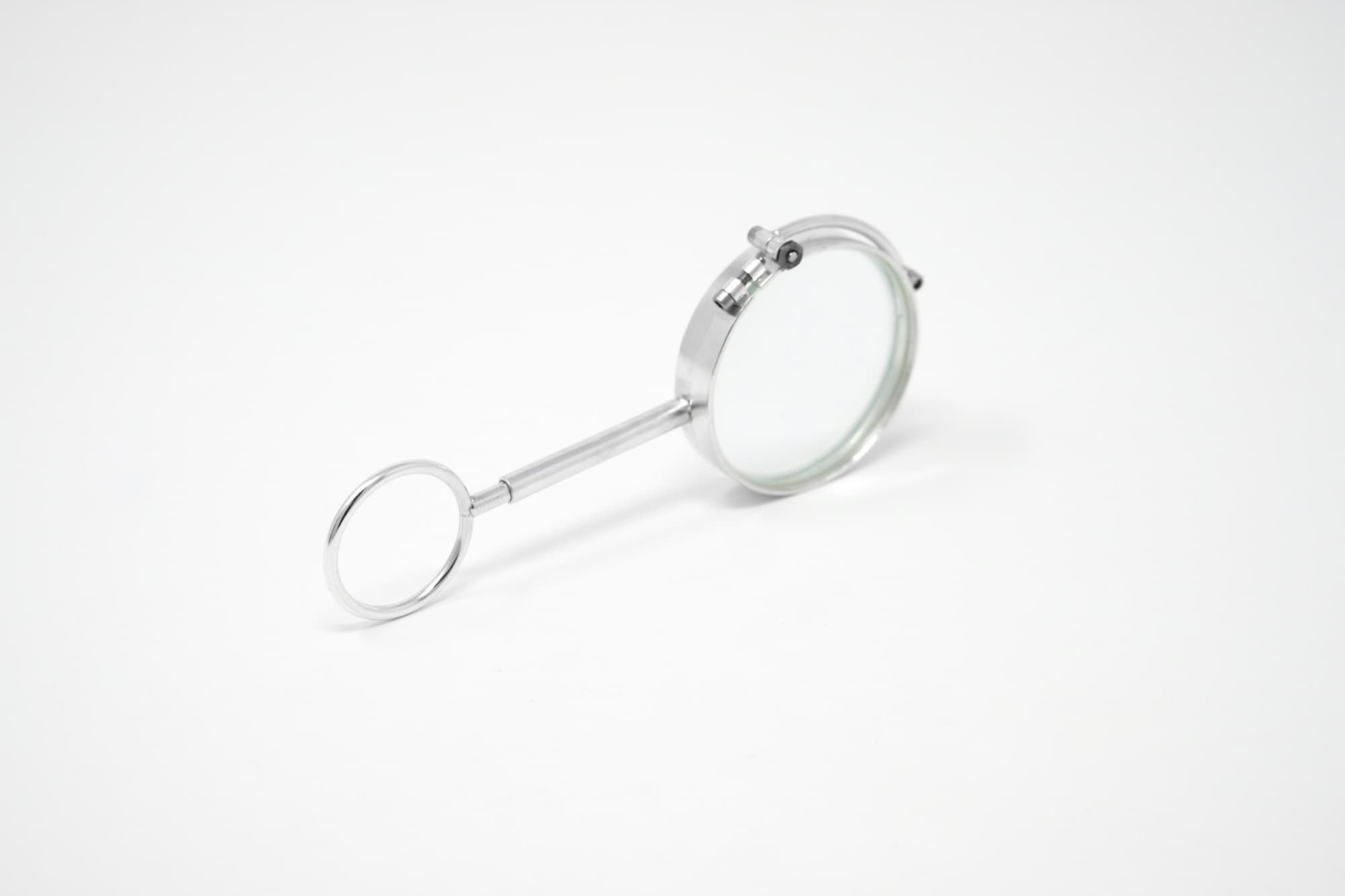 A jeweler's loupe used to inspect purity